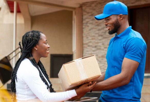 close-up-delivery-person-giving-parcel-client